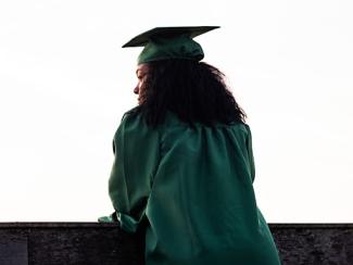Female student in graduation cap and gown