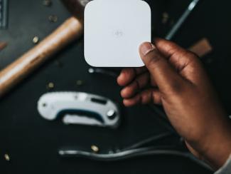 Portable credit card reader in hand
