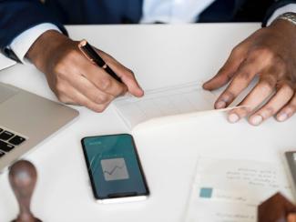 Hands writing on paper 