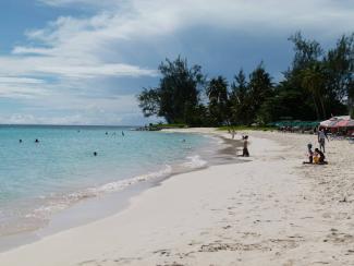 people outside on a beach in barbados
