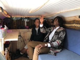 Man and woman sitting in van