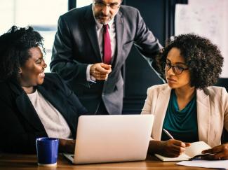 People looking at laptop