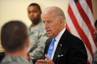 Former vice president Joe Biden talks to military servicemen