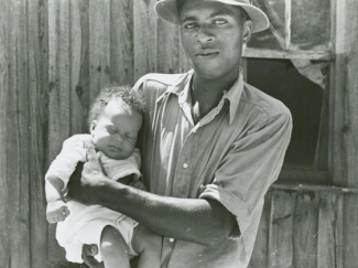 Tenant farmer with newborn child