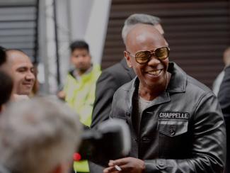 dave chappelle smiling