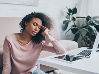 Woman with hand on her head