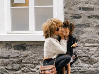 Woman hugging young girl