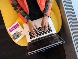 Person typing on laptop