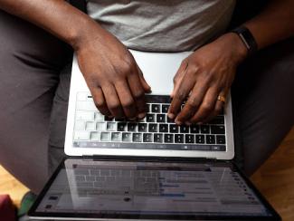 person typing on a computer 
