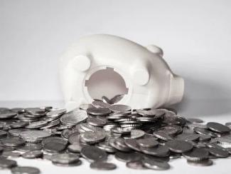 Piggy bank and coins spread out