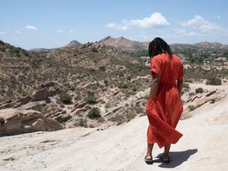 Woman looking at the mountains