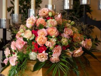 Floral arrangement on casket