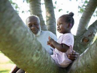 black grandfather with granddaughter 