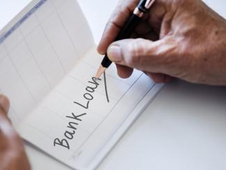 "Bank Loan" written in check book