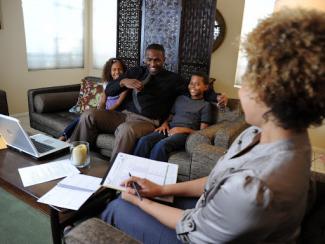 Family sitting in living room