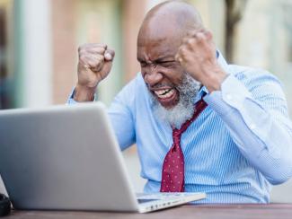 Man frustrated in front of computer