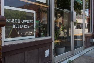 "Black Owned Business" sign in window