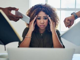 Stressed woman rubbing her temples