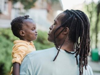 Man holding a young child