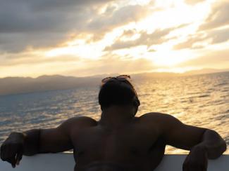 Person at pool during sunrise