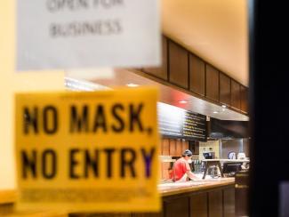 "No Mask, No Entry" sign in window