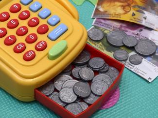 Toy cash register with fake money