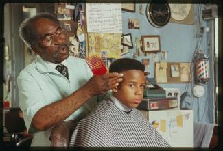 Louis McDowell gives Michael Young a "high-top fade" haircut.
