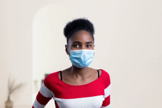 woman with surgical mask covering half of her face