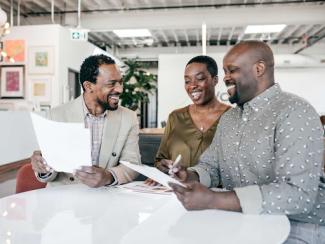 black couple working with financial advisor