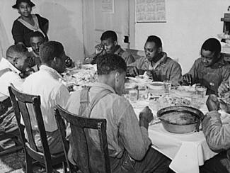 black tenants eating dinner