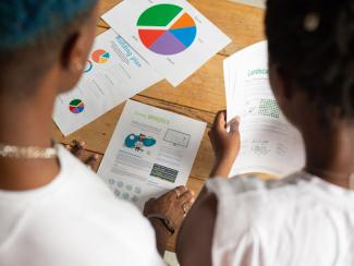 two black people analyzing diagrams