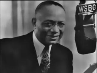 jack cooper in front of a radio microphone