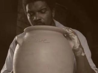 david drake making a piece of pottery