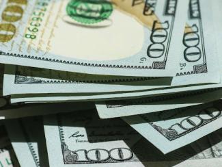 pile of 100 dollar bills