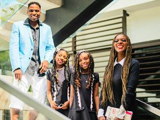 goring family standing together smiling