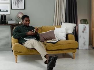 black man sitting on the couch