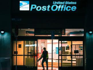 person exiting a post office 