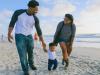Family walking on beach