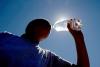 Person drinking a bottle of water