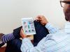 Man reading charts on tablet