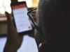Man scrolling on cell phone