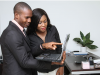 Man and woman looking at laptop