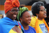 black women standing together smiling