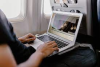 person sitting at a laptop searching online 