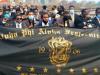 alpha phi alpha holding flag