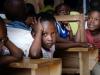 black child with hands and arms up in distress 