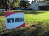 sign that says now hiring