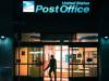 person exiting a post office 