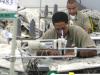 black prisoner sitting down at a sewing machine working